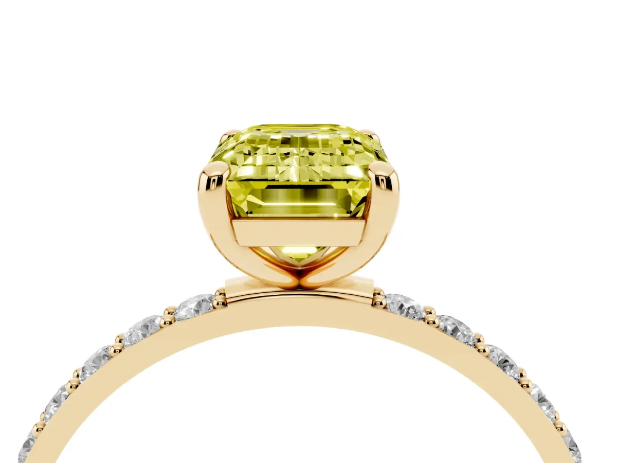 Fancy Yellow Emerald Cut Diamond Solitaire Ring with Round Pavé Band and Prong Setting Yellow gold