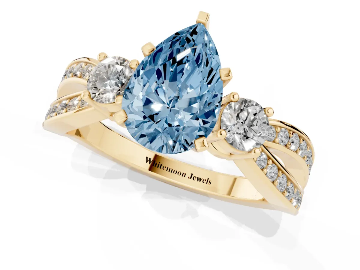 Fancy Blue Three-Stone Pear Cut Cut Diamond Twist Band with Prong Setting Yellow gold