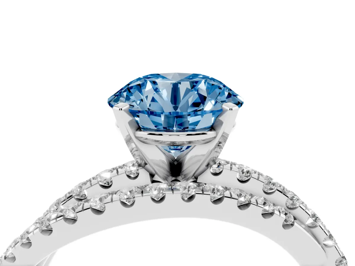 Fancy Blue Round Cut Solitaire Twist Band with Pavé Setting and Four-Prong Setting Silver