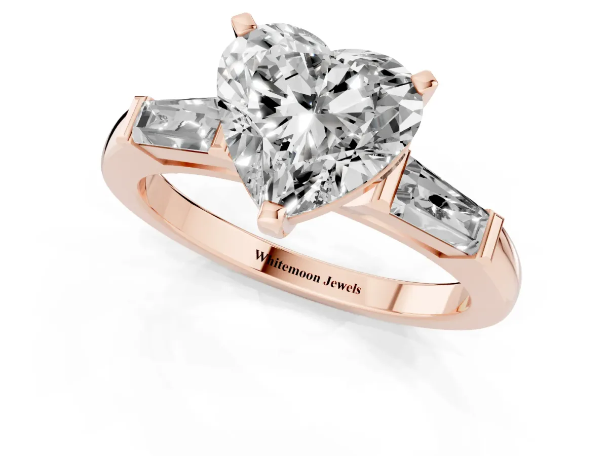 Heart Cut Solitaire with Tapered Baguette Side Stones on a Classic Band with Four-Prong Setting Rose gold