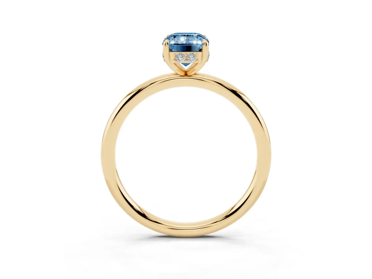 Fancy Blue Emerald Cut Solitaire Diamond Ring with a Classic Band and Four-Prong Setting Yellow gold