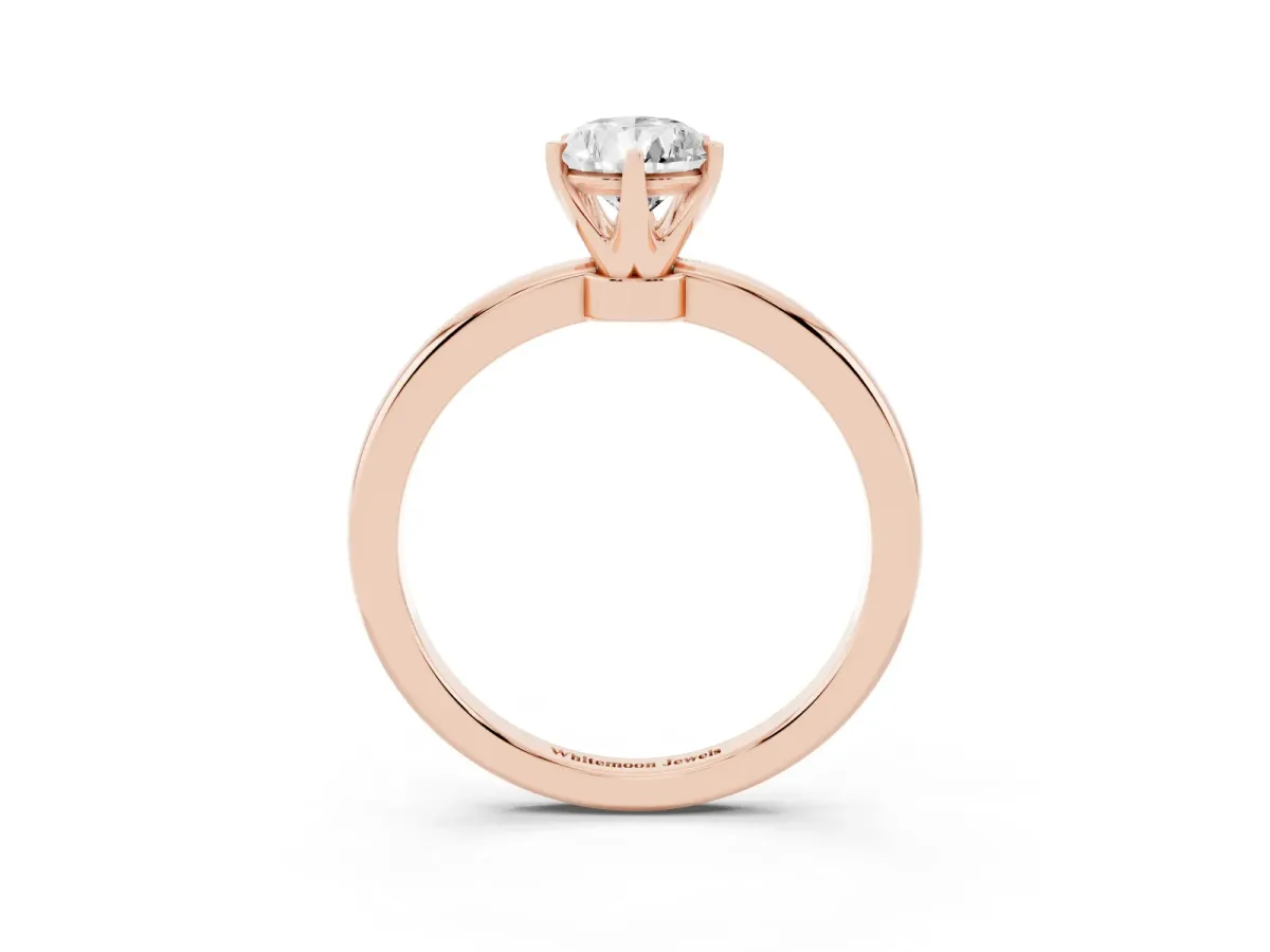 Pear Cut Solitaire Diamond Ring with Six-Prong Setting on a Classic Band Rose gold