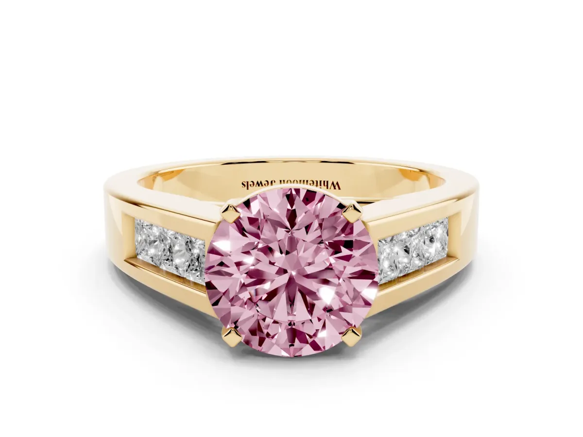Fancy Pink Round Cut Cut Channel Set Solitaire Ring with Four-Prong Setting Yellow gold