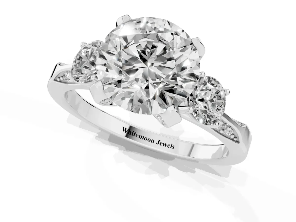 Round Cut Brilliant Three-Stone Diamond Ring with Pavé Band and Four-Prong Setting Silver