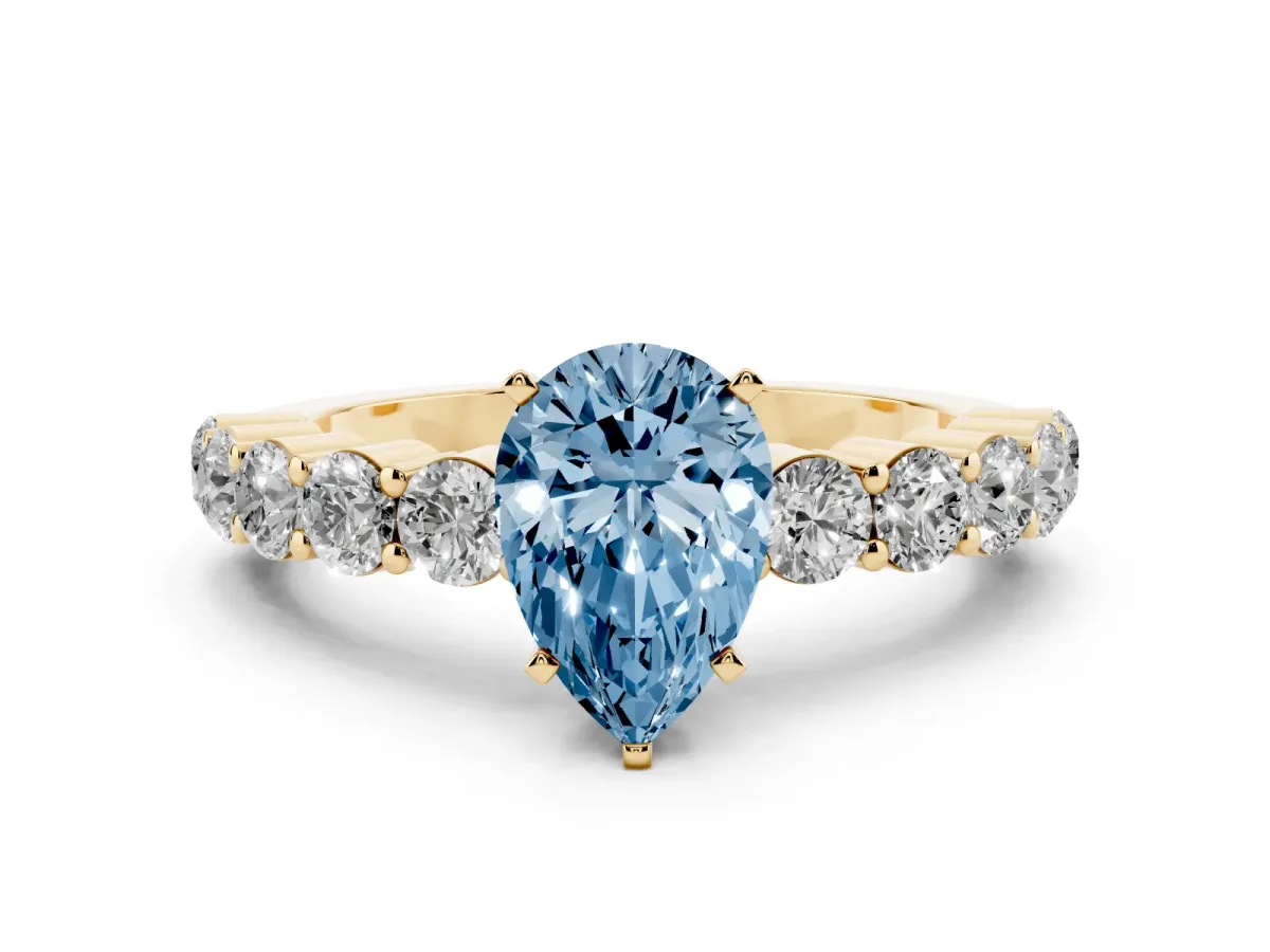 Fancy Blue Pear Cut Diamond Solitaire Ring with Shared Prong Round Side Stones Yellow gold