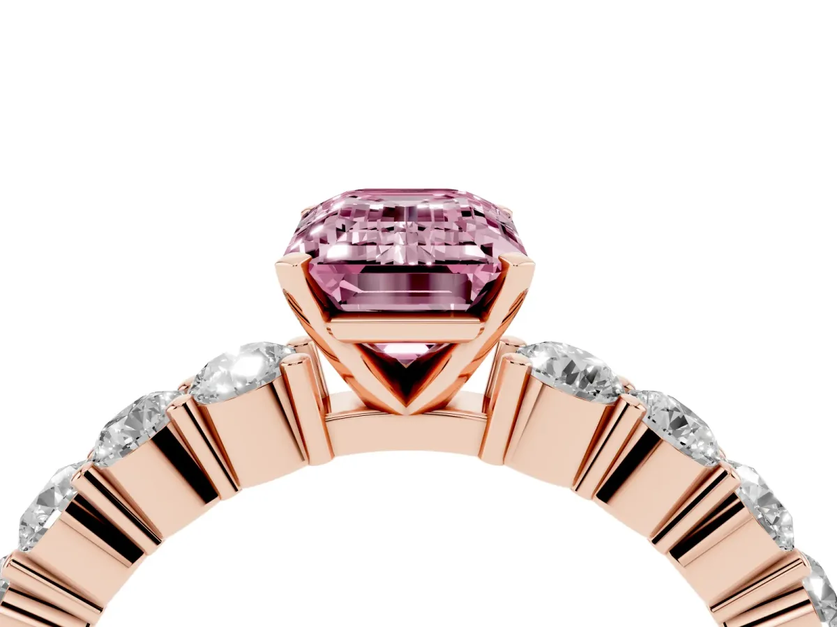Fancy Pink Emerald Cut Diamond Solitaire Ring with Shared Prong Round Side Stones Rose gold