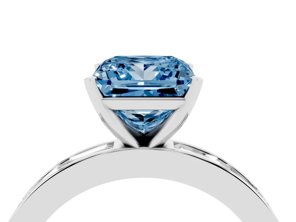 Fancy Blue Princess Cut Solitaire Diamond Ring with Channel-Set Baguette Band and Four-Prong Setting Platinum