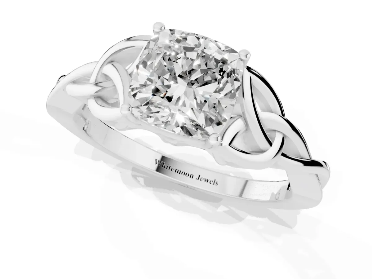 Cushion Cut Diamond Solitaire Engagement Ring with Celtic Knot Band and Four-Prong Setting Platinum