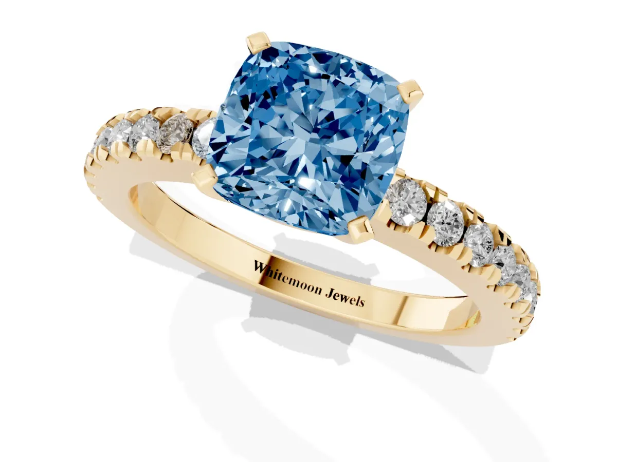 Fancy Blue Cushion Cut Solitaire Diamond with Pavé Band and Four-Prong Setting Yellow gold