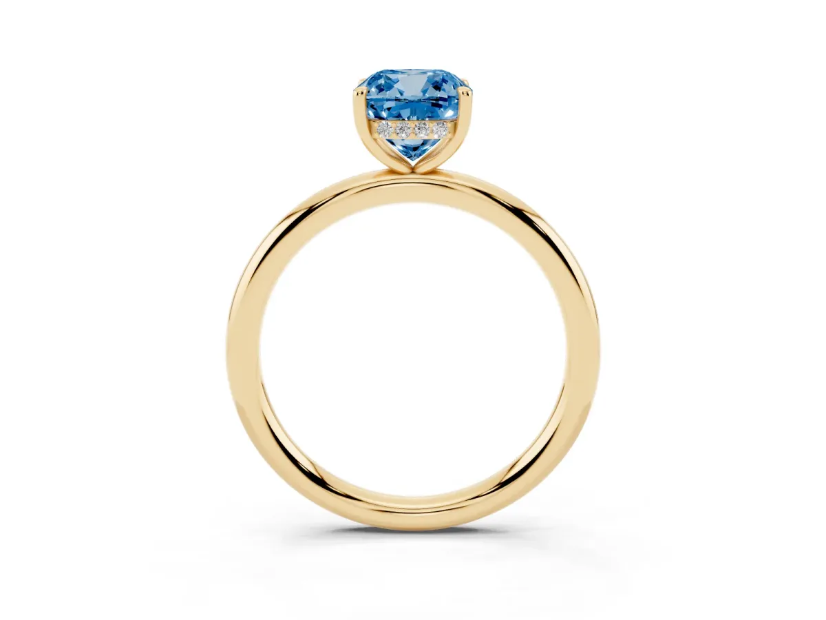 Fancy Blue Cushion Cut Diamond Solitaire Ring with Thin Band and Four-Prong Setting Yellow gold