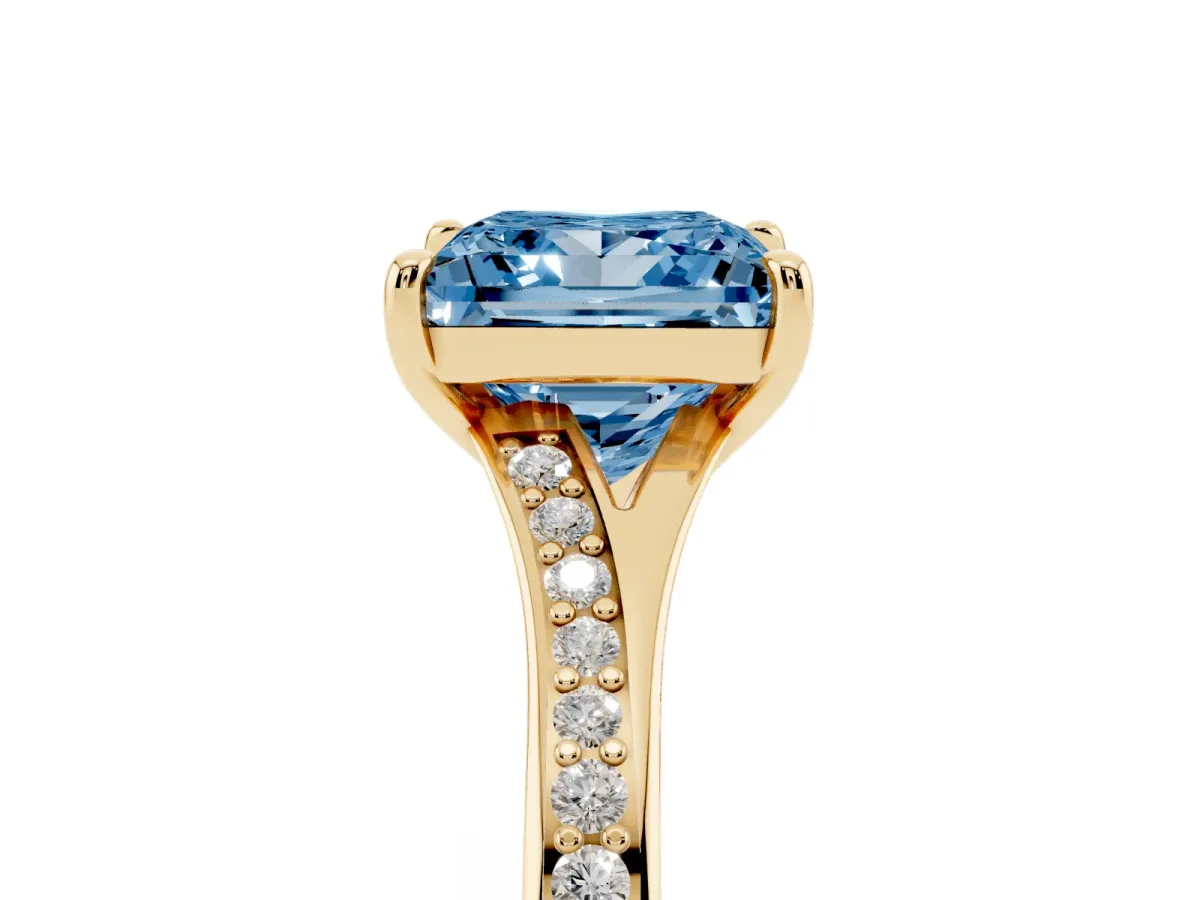 Fancy Blue Princess Cut Diamond Solitaire Ring with Pavé Band and Prong Setting Yellow gold
