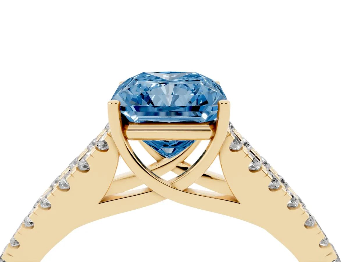Fancy Blue Radiant Cut Diamond Split Shank Engagement Ring with Round Pavé and Prong Setting Yellow gold