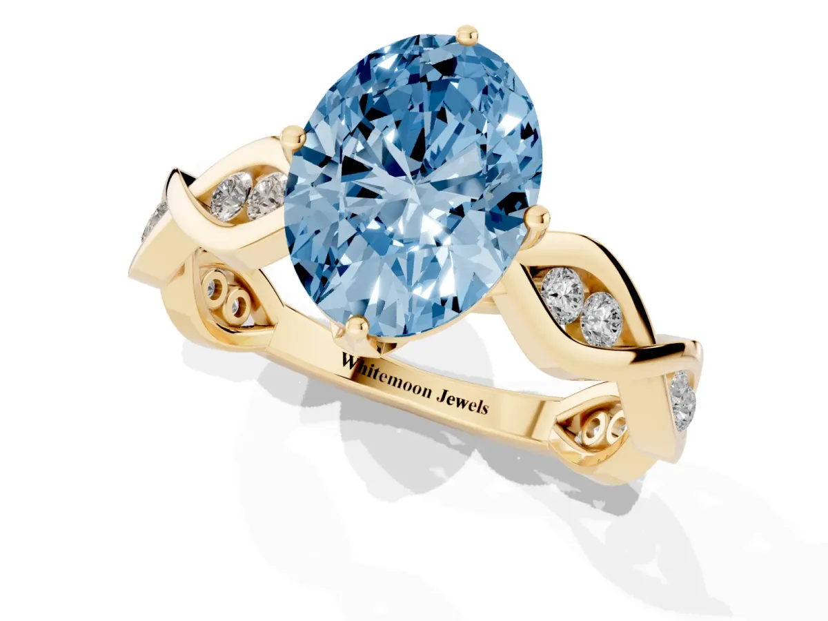 Fancy Blue Oval Cut Solitaire Twist Band with Leaf Prong Setting Yellow gold