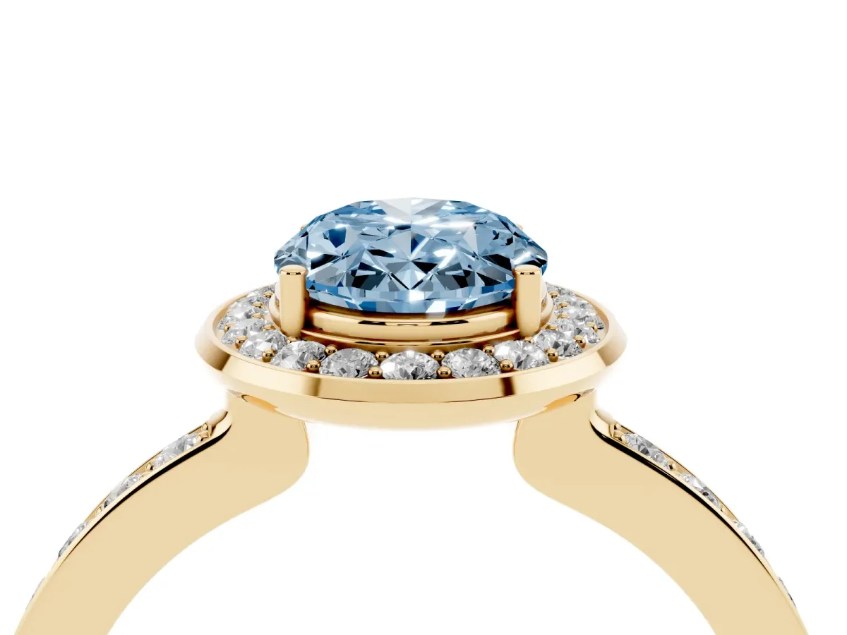 Fancy Blue Oval Cut Diamond Halo Ring with Bezel Frame and Pavé Band Yellow gold