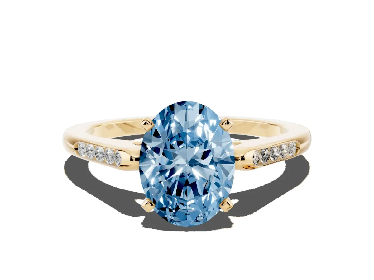 Fancy Blue Oval Cut Diamond Solitaire Ring with Channel Set Round Band and Prong Setting Yellow gold