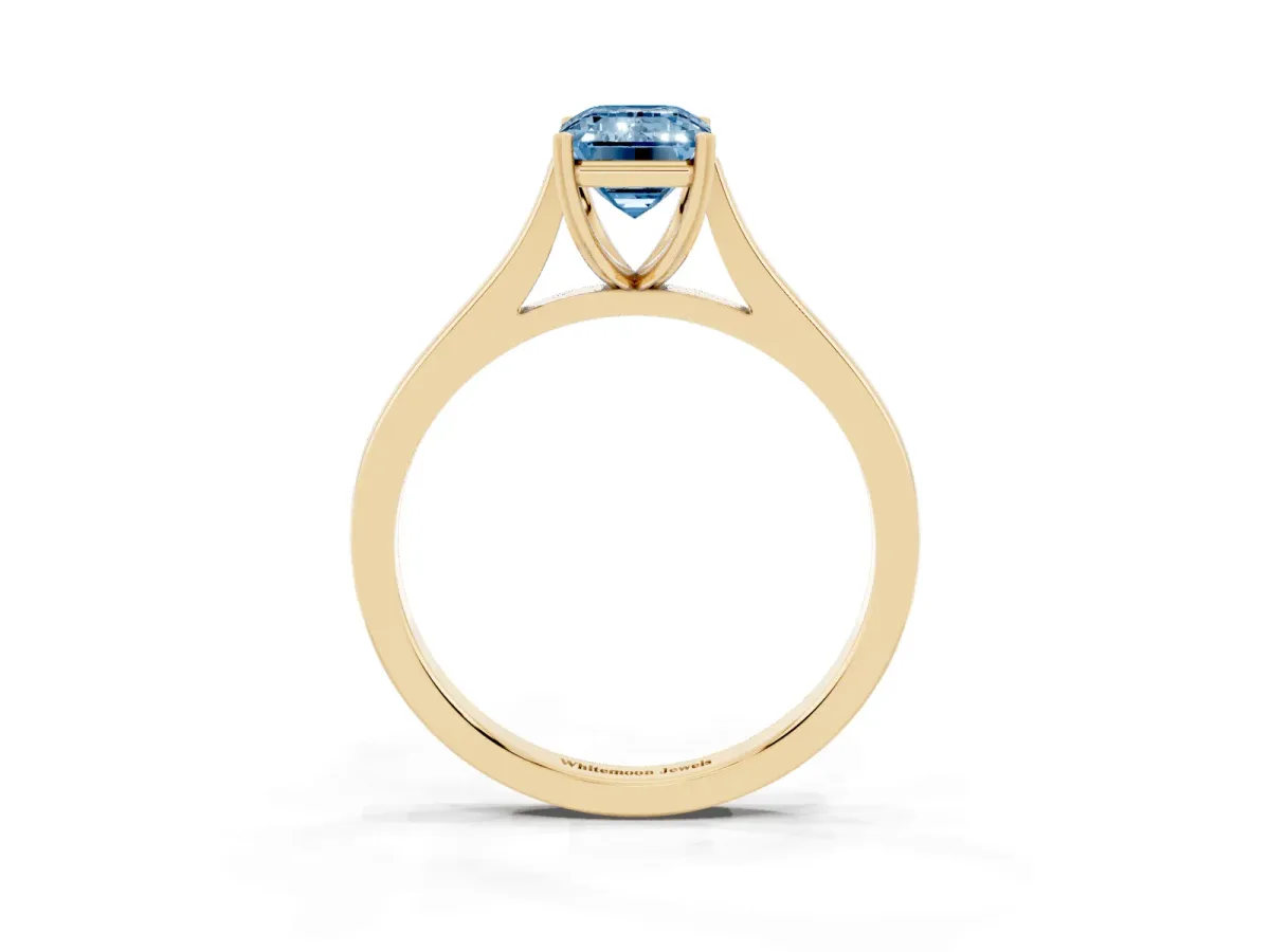 Fancy Blue Emerald Cut Solitaire Heart Prong Engagement Ring with Tapered Band Yellow gold