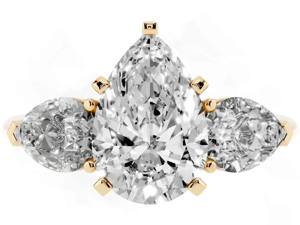 Three-Stone Pear Cut Diamond Ring with Pear Side Stones and Four-Prong Setting Yellow gold