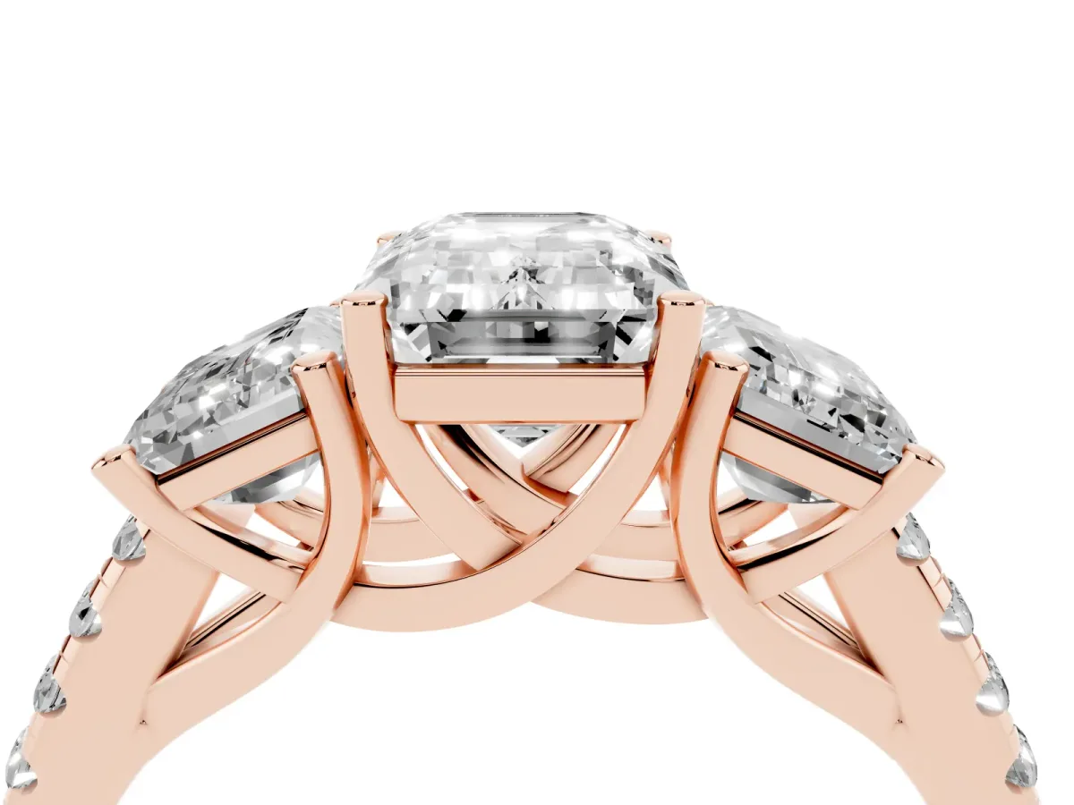 Three-Stone Emerald Cut Diamond Ring with Round Pavé Band and Prong Setting Rose gold