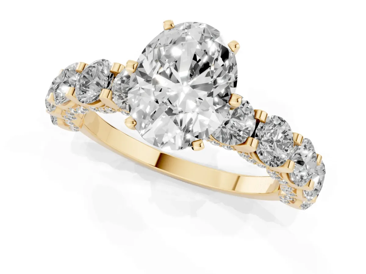 Oval Cut Diamond Side Stone Engagement Ring with Four-Prong Setting Yellow gold