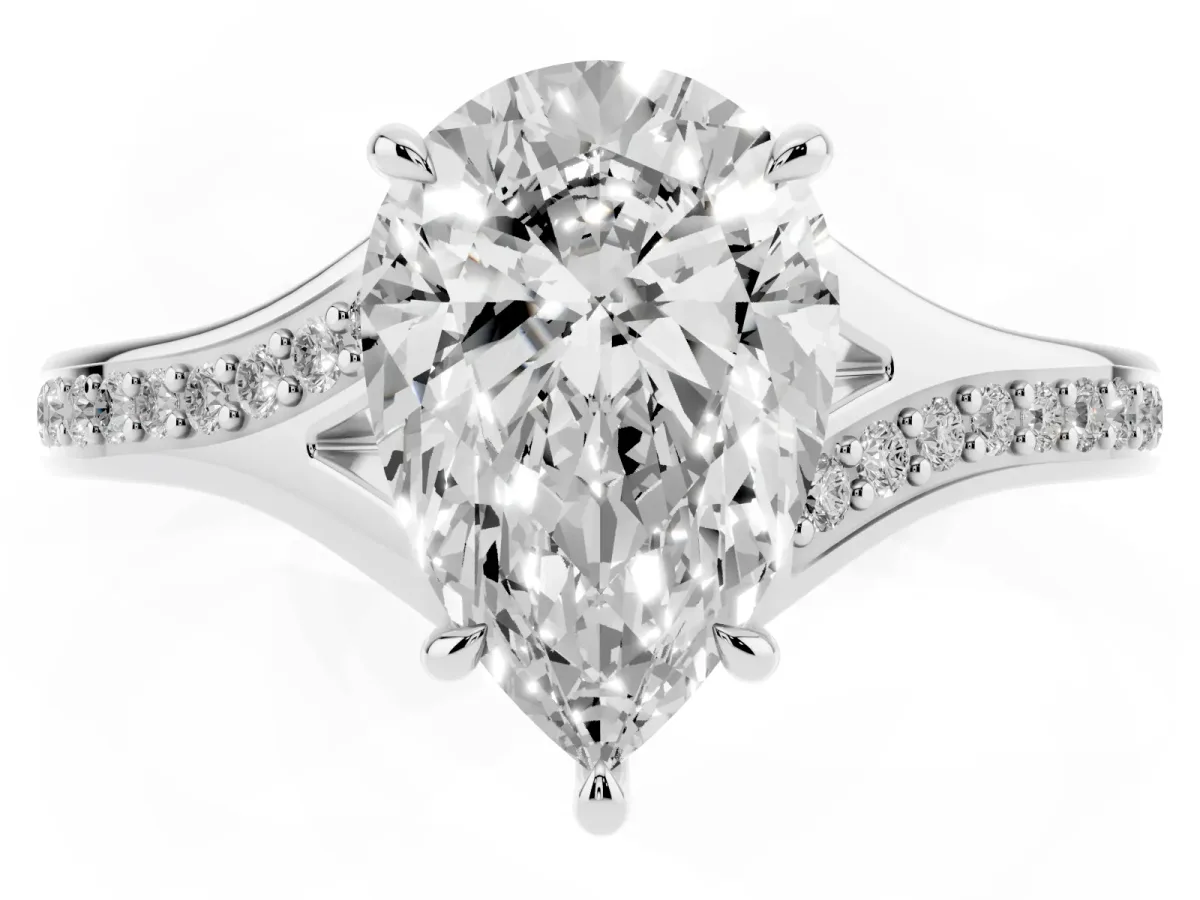 Pear Cut Diamond Solitaire Ring with Pavé Band and Prong Setting Silver