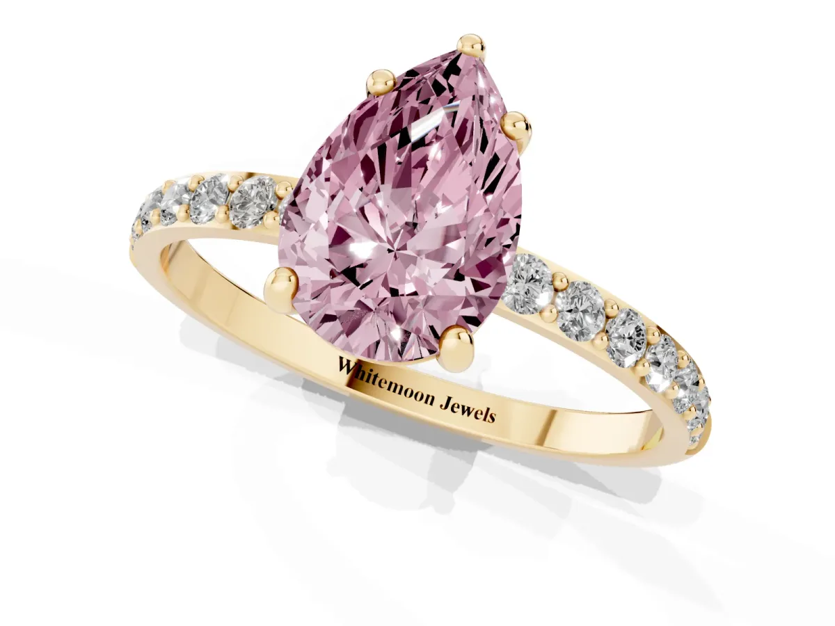 Fancy Pink Pear Cut Diamond Solitaire Ring with Round Pavé Band and Prong Setting Yellow gold