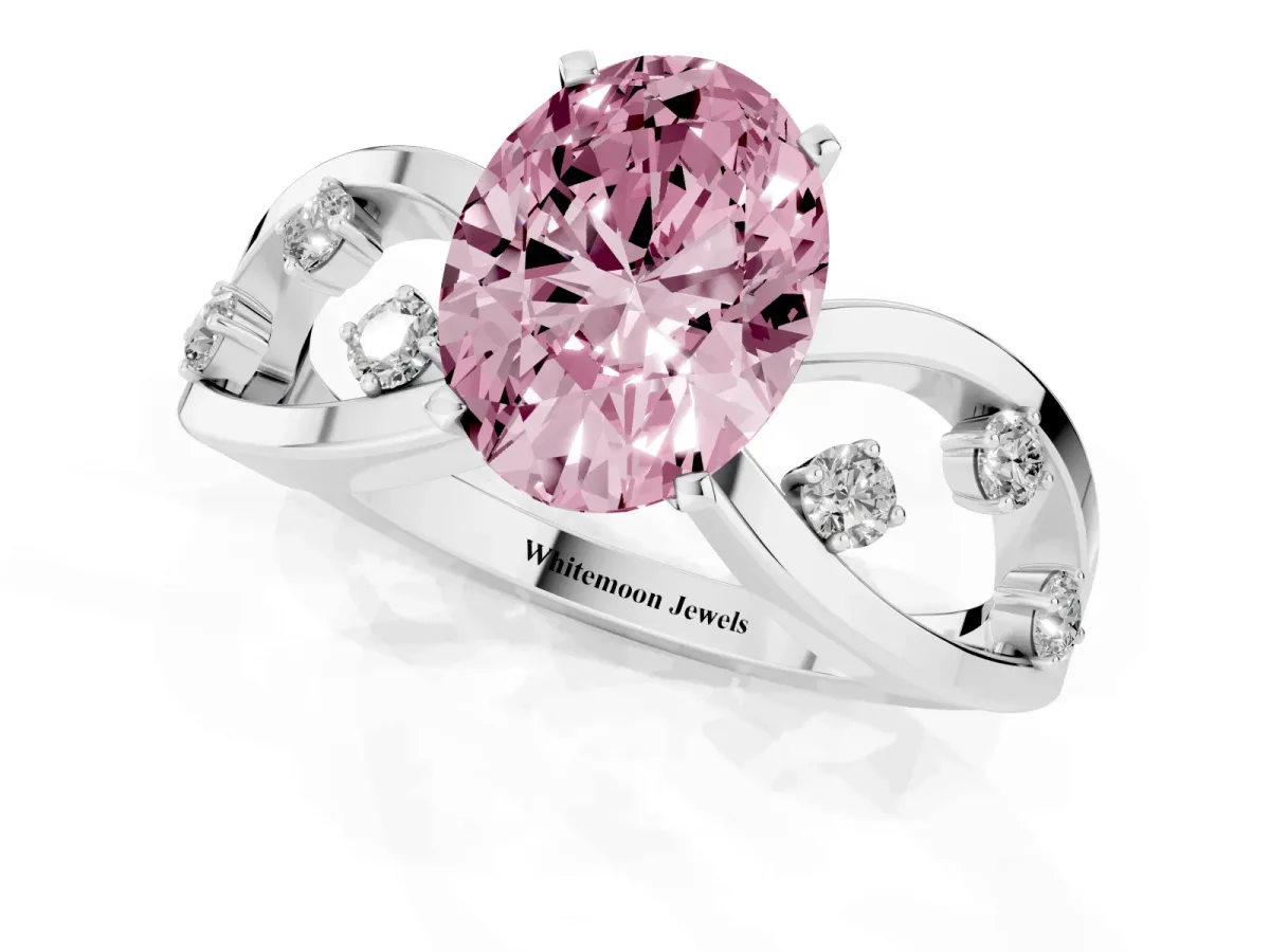 Fancy Pink Oval Cut Cut Solitaire Diamond with Side Stones on Criss-Cross Band and Four-Prong Setting Platinum