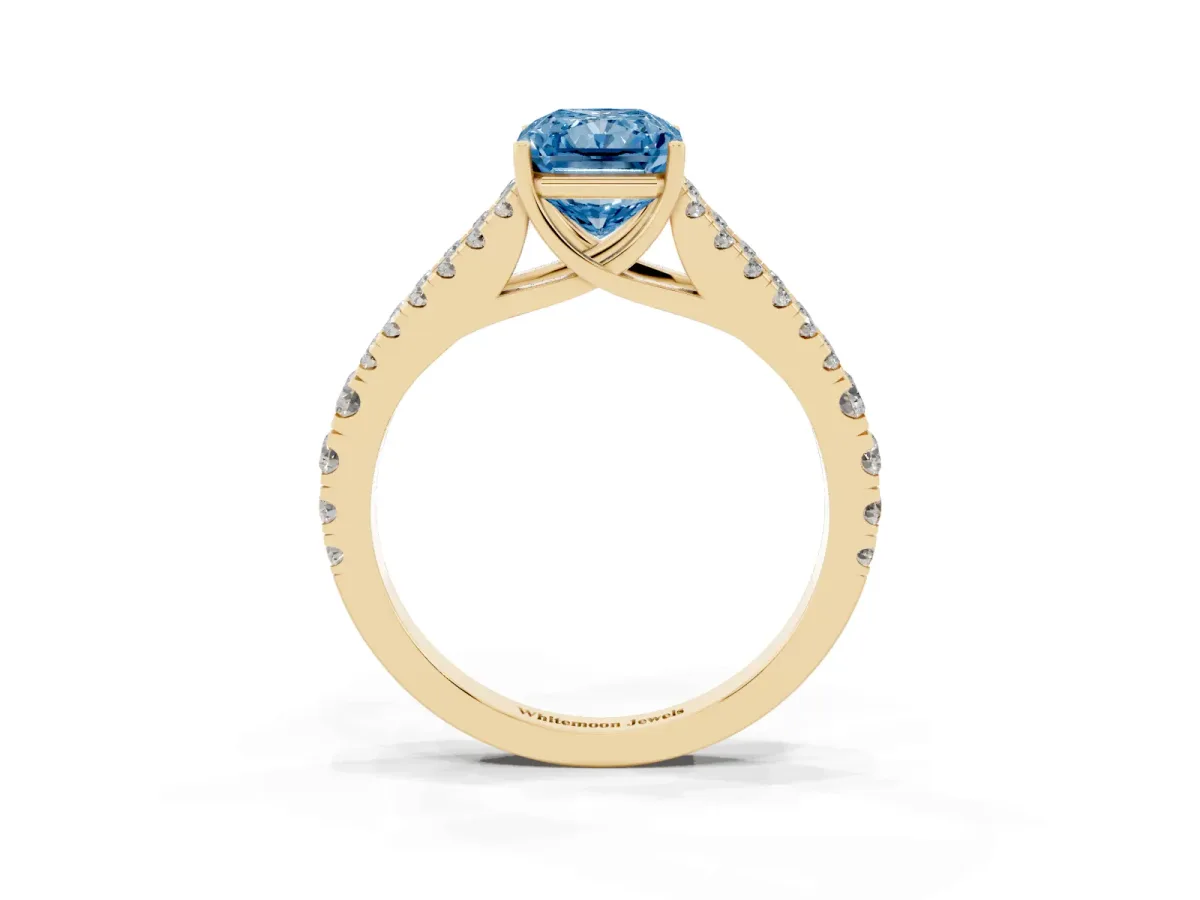 Fancy Blue Radiant Cut Diamond Split Shank Engagement Ring with Round Pavé and Prong Setting Yellow gold