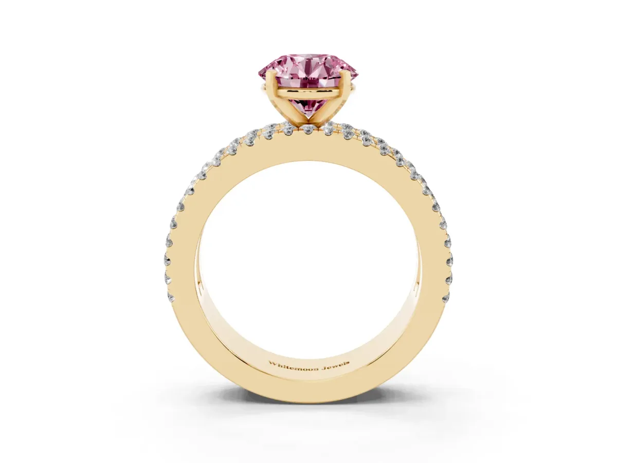 Fancy Pink Round Cut Diamond Solitaire Ring with Pavé and Channel Set Band Yellow gold