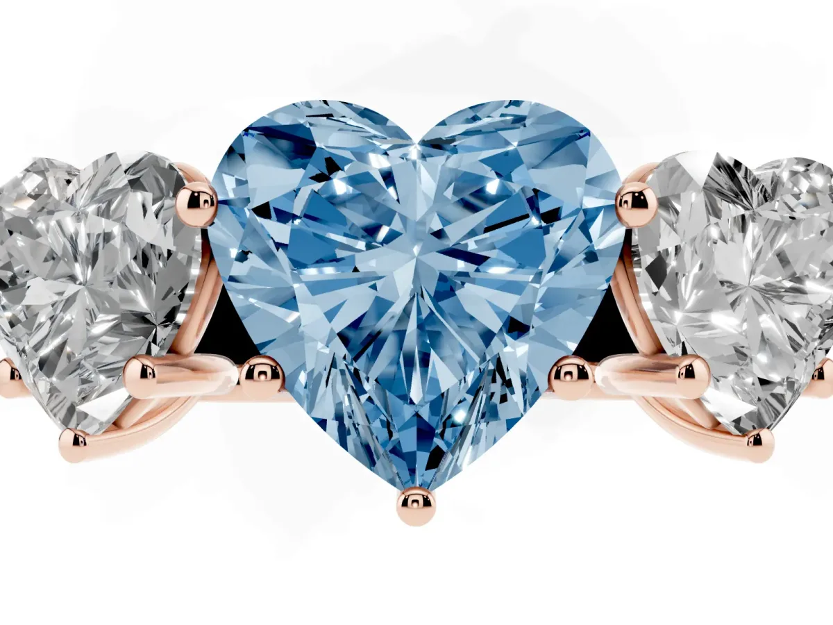 Fancy Blue Heart Cut Three-Stone Diamond Ring with Prong Setting on a Classic Band Rose gold