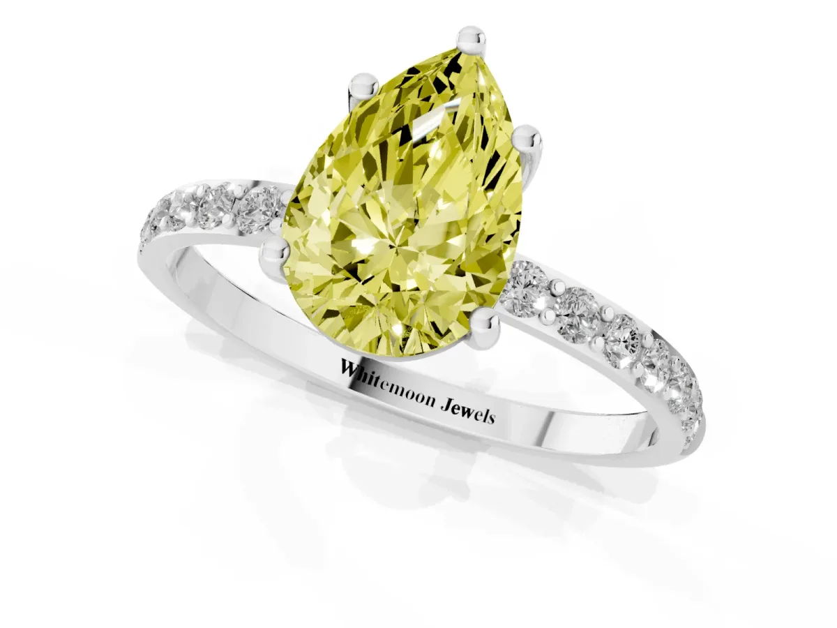Fancy Yellow Pear Cut Diamond Solitaire Ring with Round Pavé Shoulders and Prong Setting Platinum