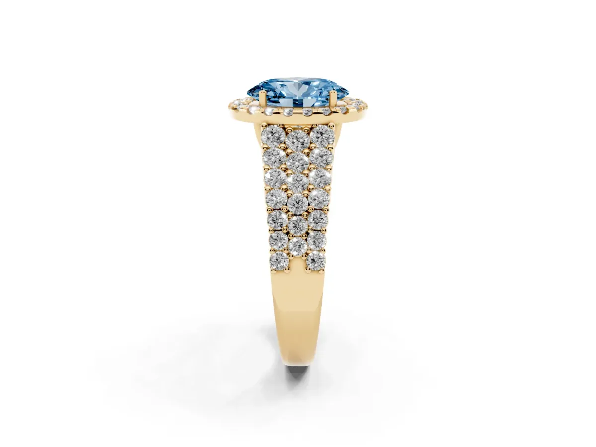 Fancy Blue Oval Cut Diamond Halo Engagement Ring with Triple Row Round Pavé Band and Prong Setting Yellow gold