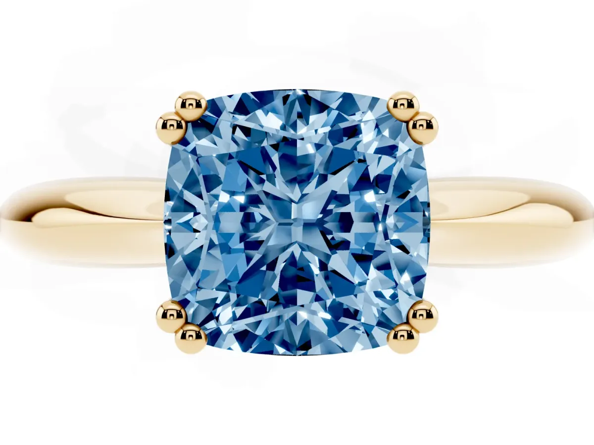 Fancy Blue Cushion Cut Cut Solitaire Engagement Ring with Tapered Band and Four-Prong Setting Yellow gold