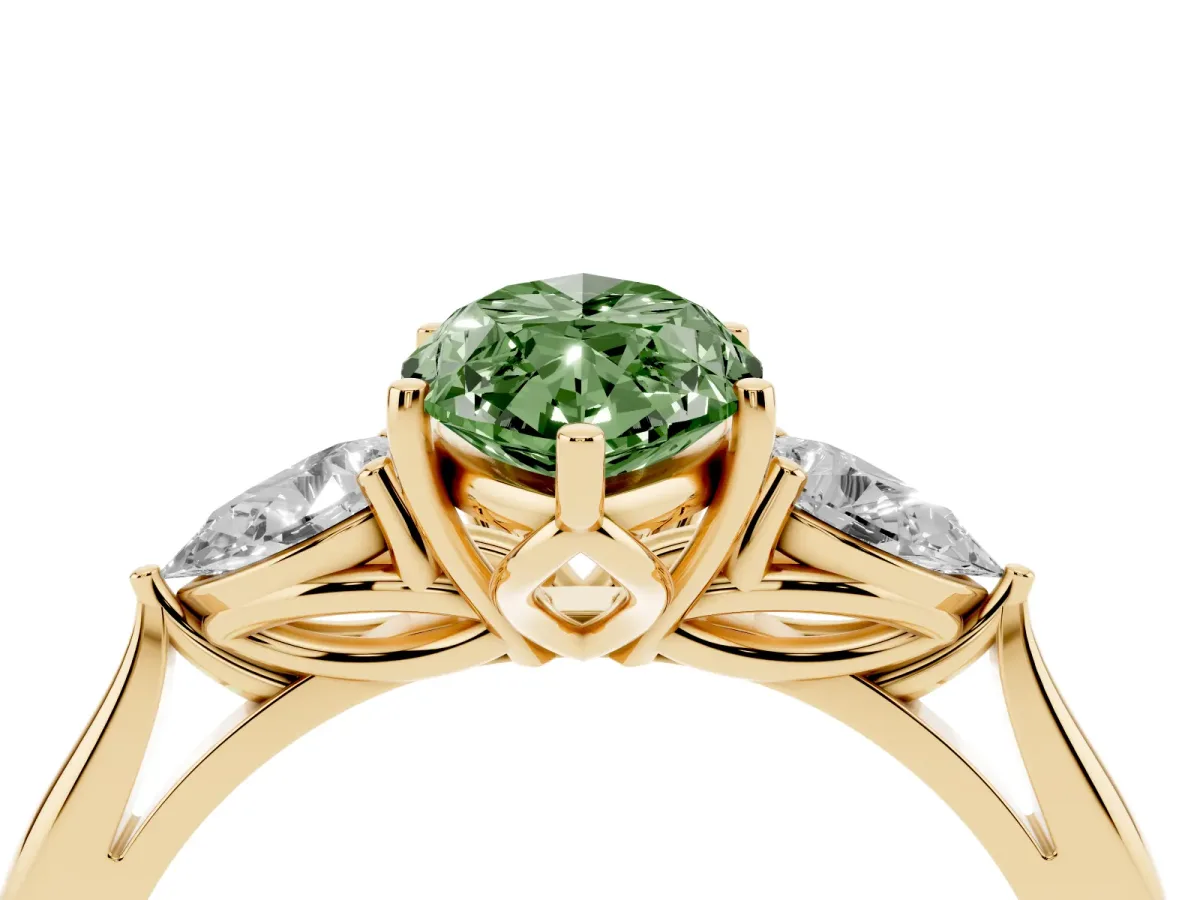 Fancy Green Three-Stone Marquise Cut Diamond Ring with Pear Side Stones in Four-Prong Setting Yellow gold