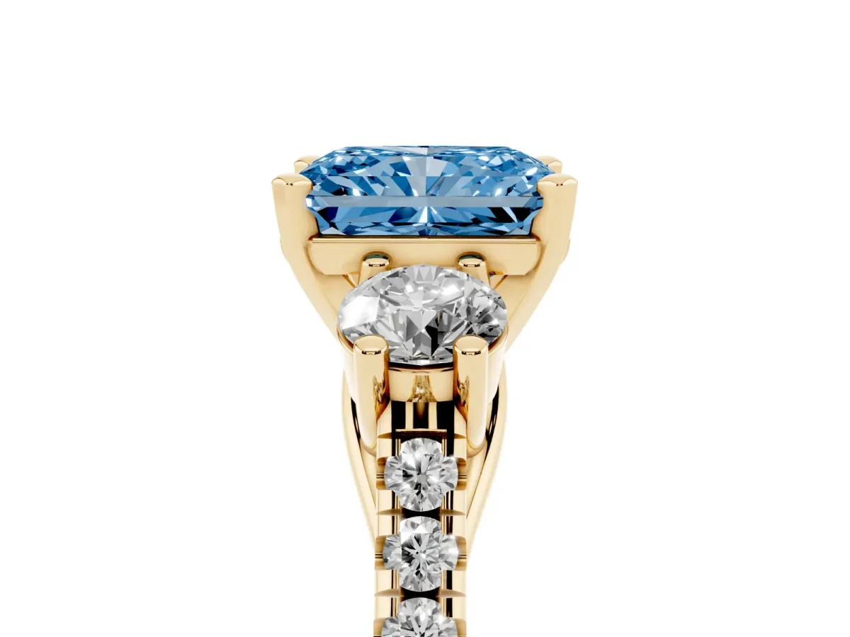 Fancy Blue Three-Stone Radiant Cut Diamond Pavé Band with Four-Prong Setting Yellow gold