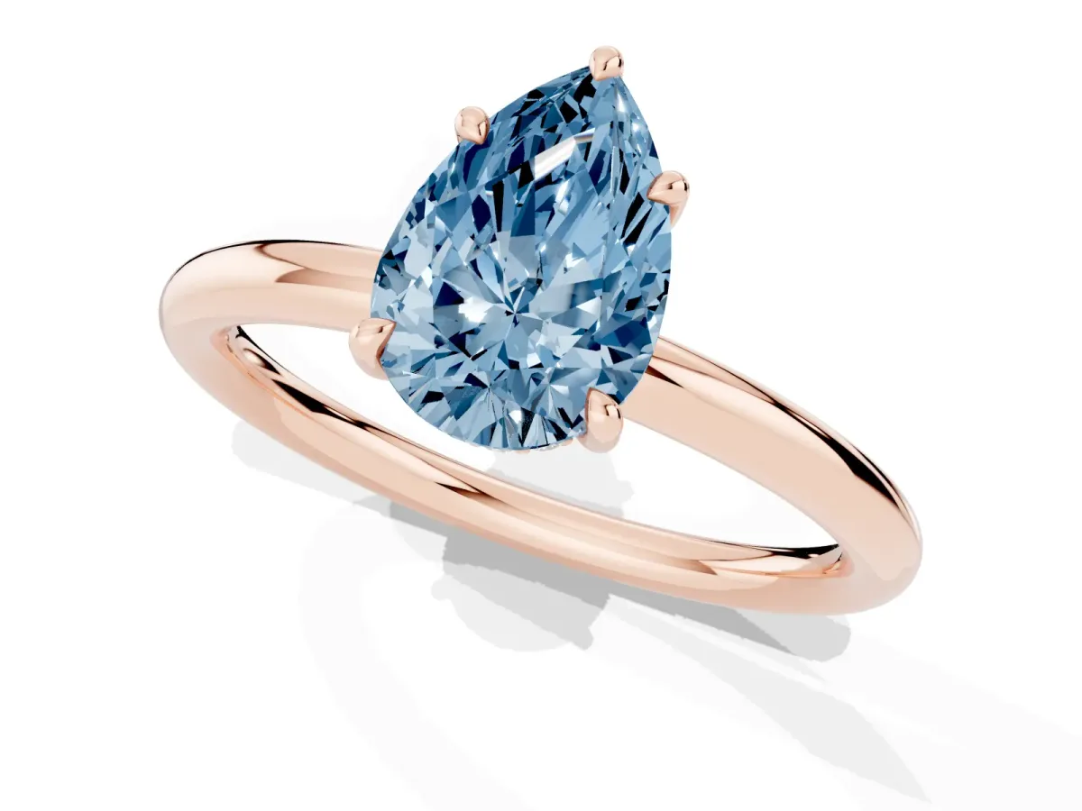Fancy Blue Pear Cut Diamond Solitaire Ring with Thin Band and Four-Prong Setting Rose gold
