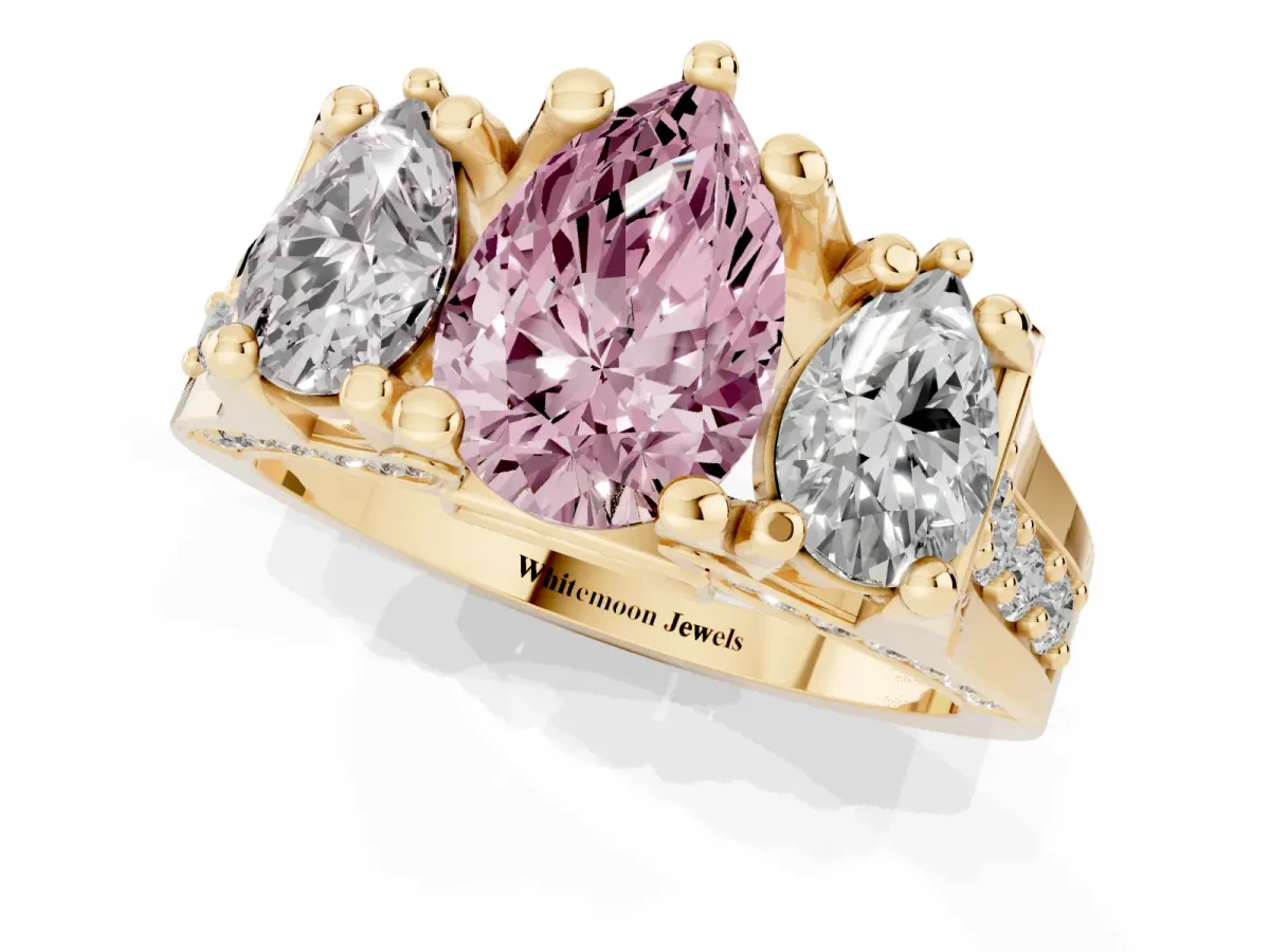 Fancy Pink Pear Cut Diamond Three-Stone Ring with Channel Set Band and Four-Prong Setting Yellow gold