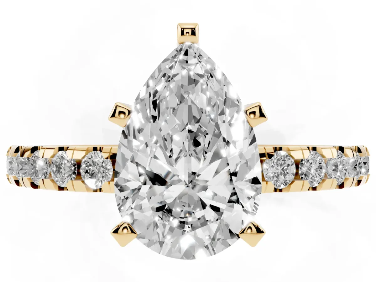 Pear Cut Diamond Solitaire Ring with Round Pavé Band and Four-Prong Setting Yellow gold