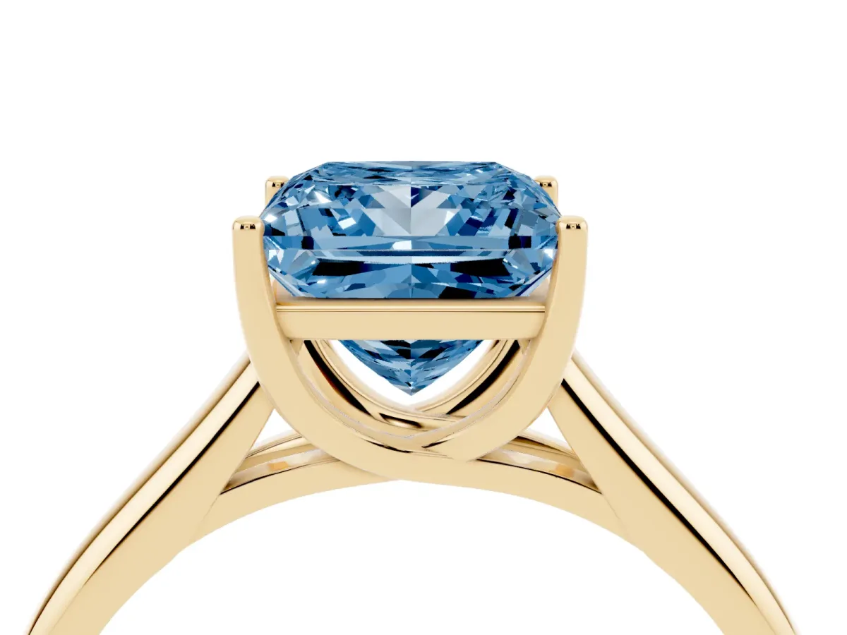 Fancy Blue Princess Cut Solitaire Engagement Ring with Tapered Band and Four-Prong Setting Yellow gold