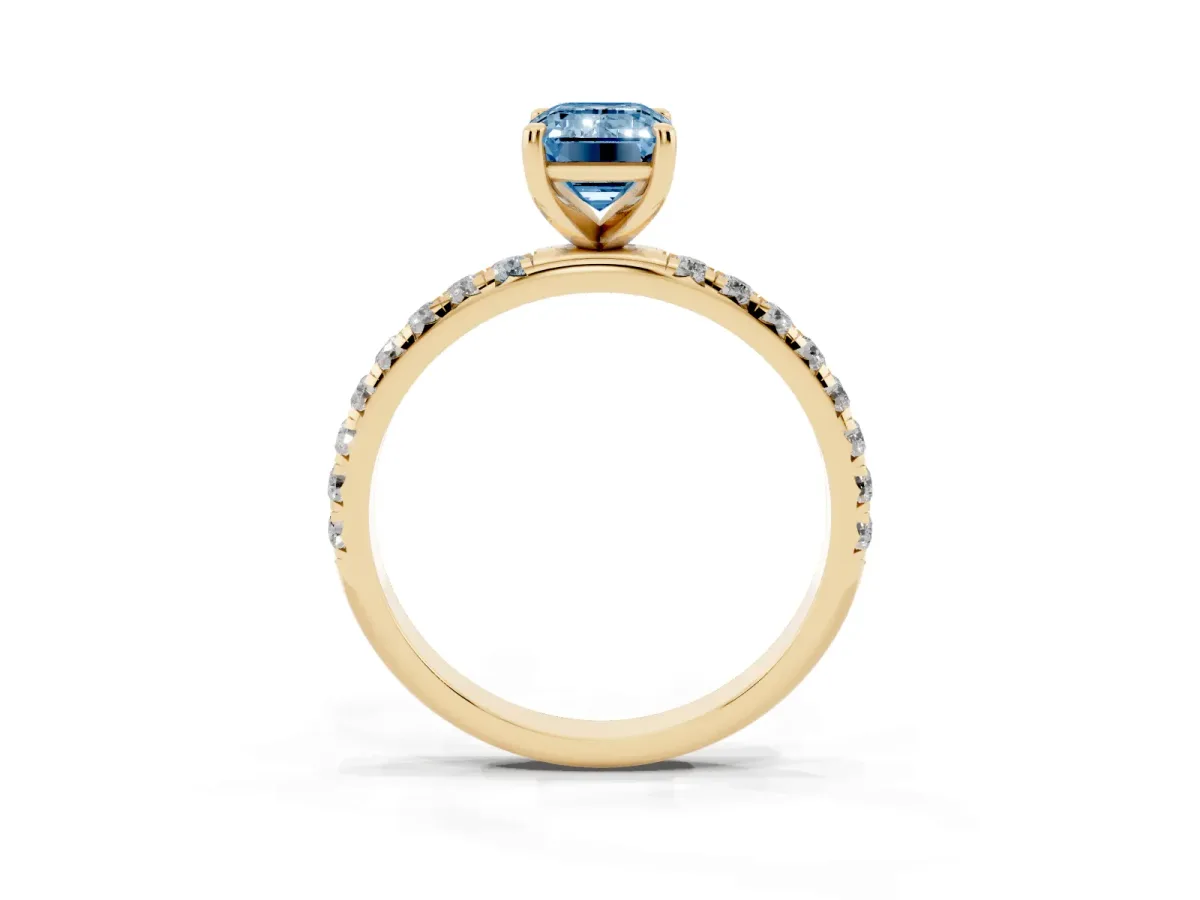 Fancy Blue Emerald Cut Cut Diamond Solitaire Ring with Micro Pave Band and Four Prong Setting Yellow gold