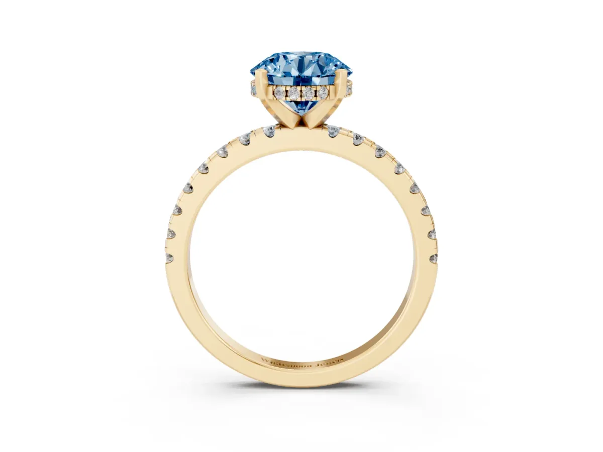 Fancy Blue Round Cut Diamond Solitaire Ring with Round Pavé Band and Four-Prong Setting Yellow gold
