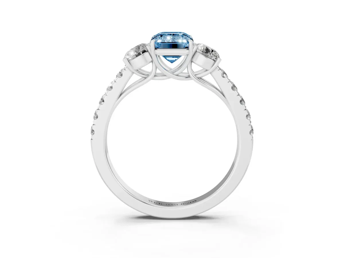 Fancy Blue Emerald Cut Cut Diamond Three-Stone Ring with Round Side Stones and Pavé Band Silver