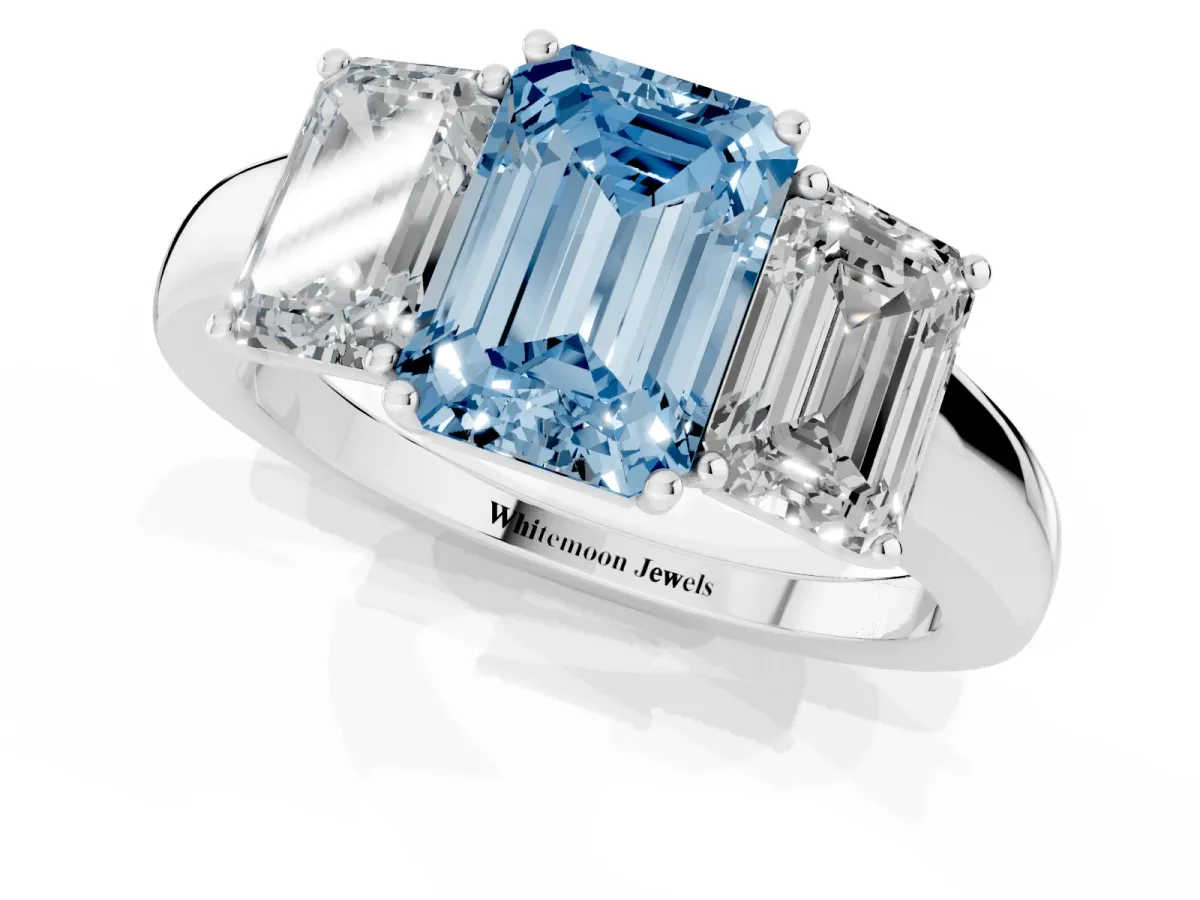 Fancy Blue Emerald Cut Diamond Three-Stone Ring with Four-Prong Setting and Classic Band Platinum