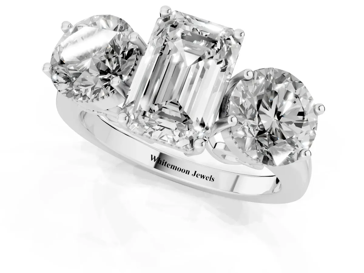 Three-Stone Emerald Cut Diamond Engagement Ring with Prong Setting on a Classic Band Platinum