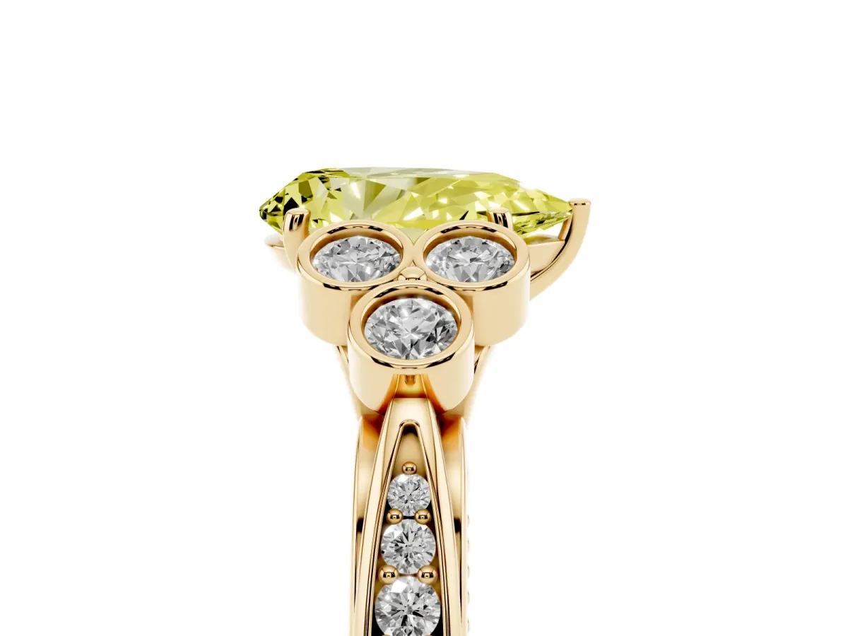 Fancy Yellow Pear Cut Cut Diamond Engagement Ring with Bezel Set Round Side Stones and Prong Setting Yellow gold