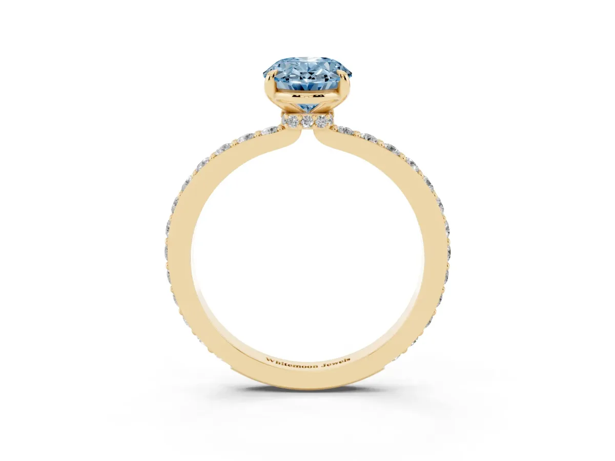 Fancy Blue Oval Cut Diamond Pavé Engagement Ring with Round Accents and Prong Setting Yellow gold