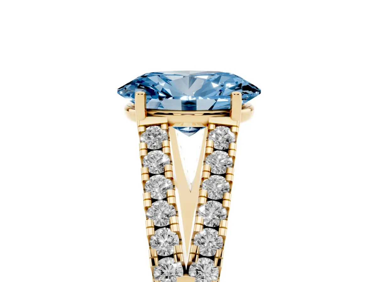 Fancy Blue Oval Cut Diamond Split Shank Engagement Ring with Round Pavé and Prong Setting Yellow gold