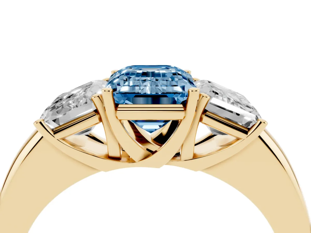 Fancy Blue Emerald Cut Diamond Three-Stone Ring with Four-Prong Setting and Classic Band Yellow gold