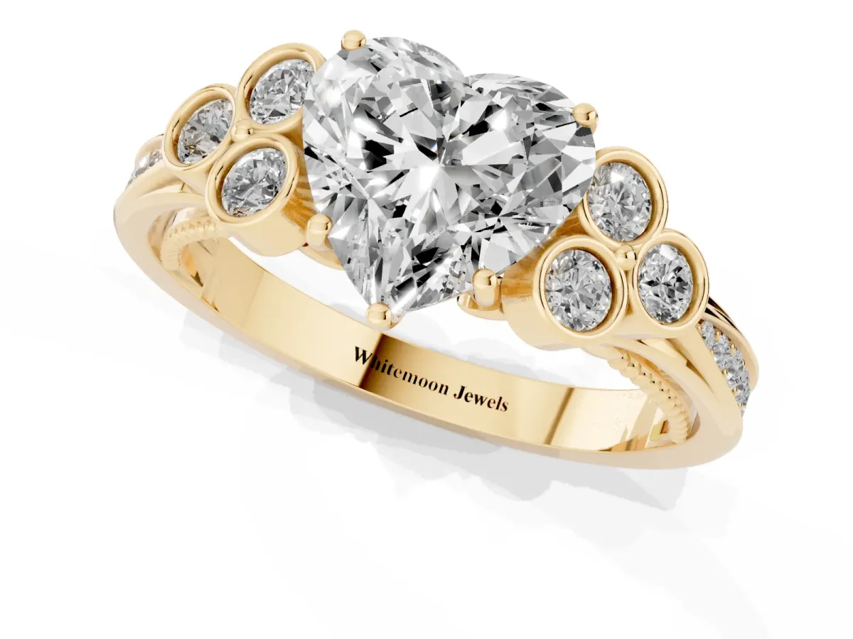 Heart Cut Cut Diamond Engagement Ring with Bezel Set Round Side Stones and Prong Setting Yellow gold
