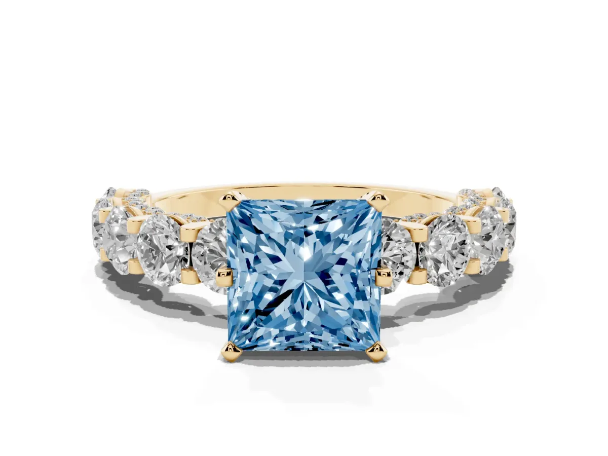 Fancy Blue Princess Cut Diamond Side Stone Engagement Ring with Four-Prong Setting Yellow gold