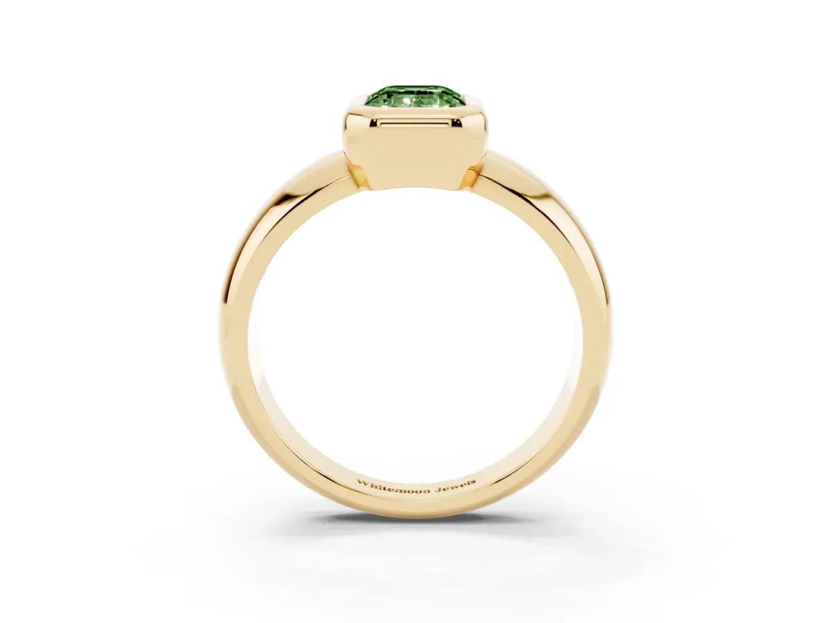 Fancy Green Bezel Set Emerald Cut Solitaire Ring with Wide Band Yellow gold